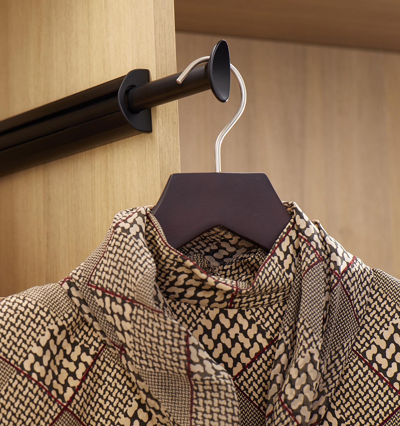 Custom closet accessories storage showing clothes valet rod designed from California Closets