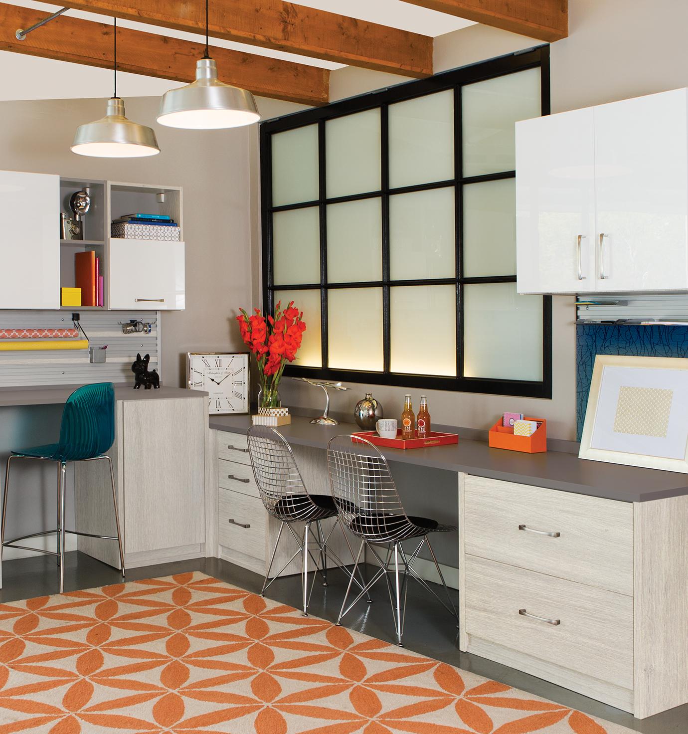 Crafting room space with two desks and extra cabinet storage from California Closets