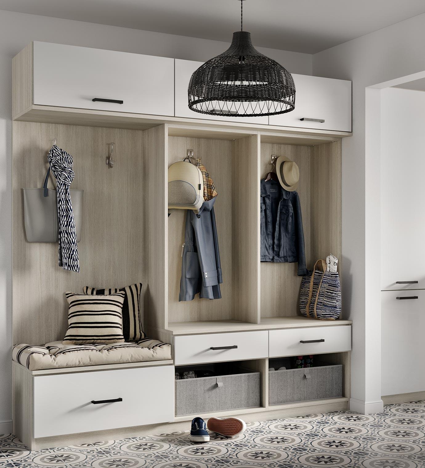 Entryway closet solution with custom cabinets, and a storage bench by California Closets