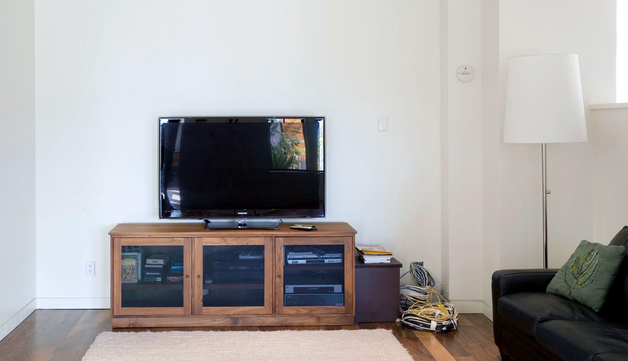 Before new, modern design to be installed for home entertainment custom storage by California Closets