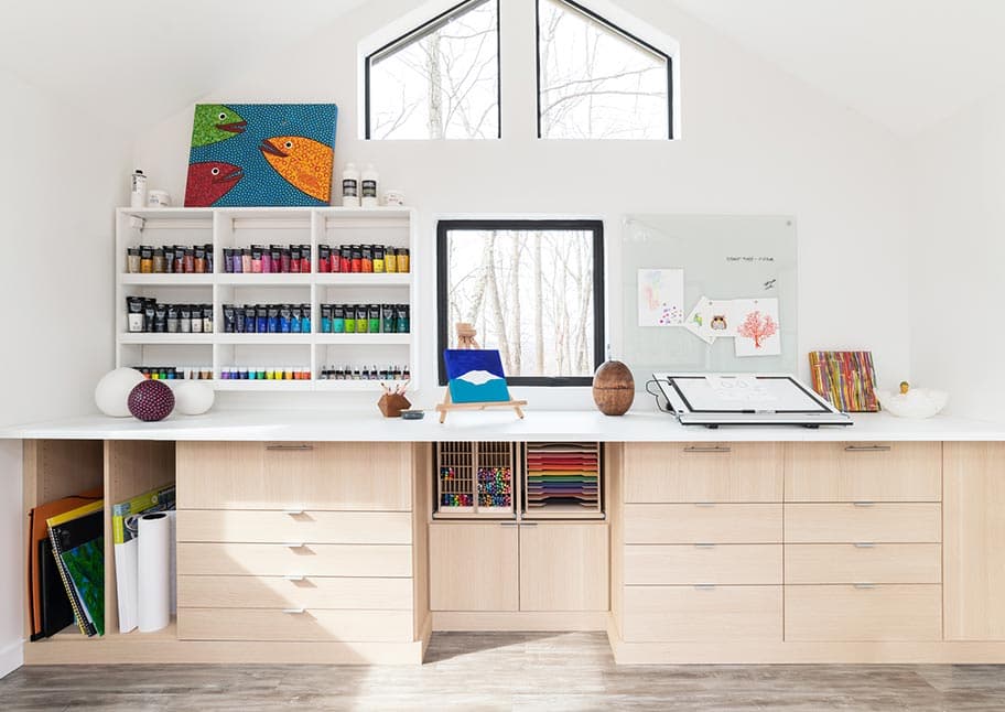 Craft room custom amde with a built in desk, and cabinets by California Closets