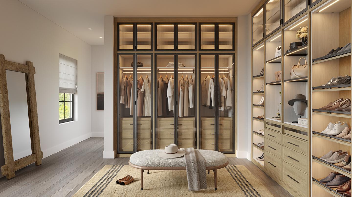 Customized walk in closet cabinetry, closthes hanging areas and shoe storage by California Closets