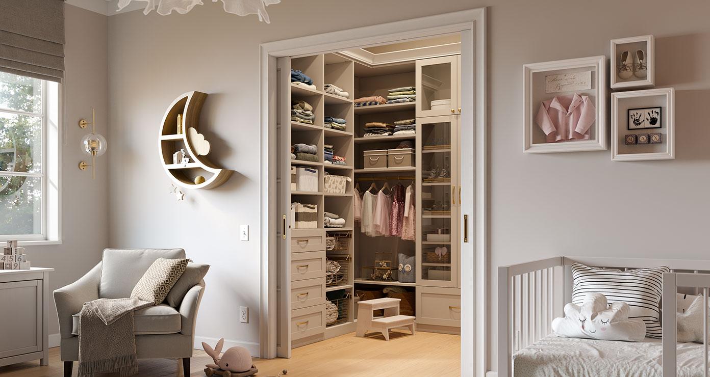 Girls closet designed with step up to storage drawers, shelves and wardrobe by California Closets