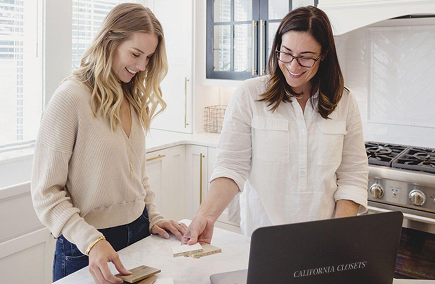 Design consultant meeting with customer to discuss custom closet plans with California Closets