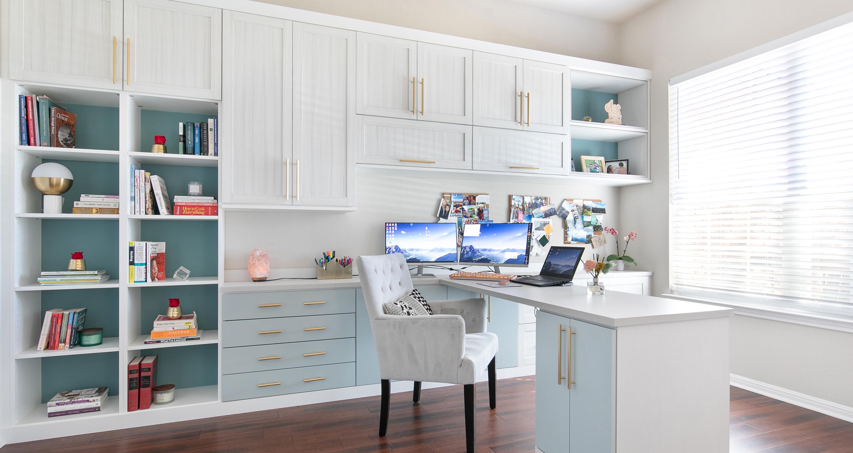 Home office in white wood finish with custom cabinets and built in desk created by California Closets