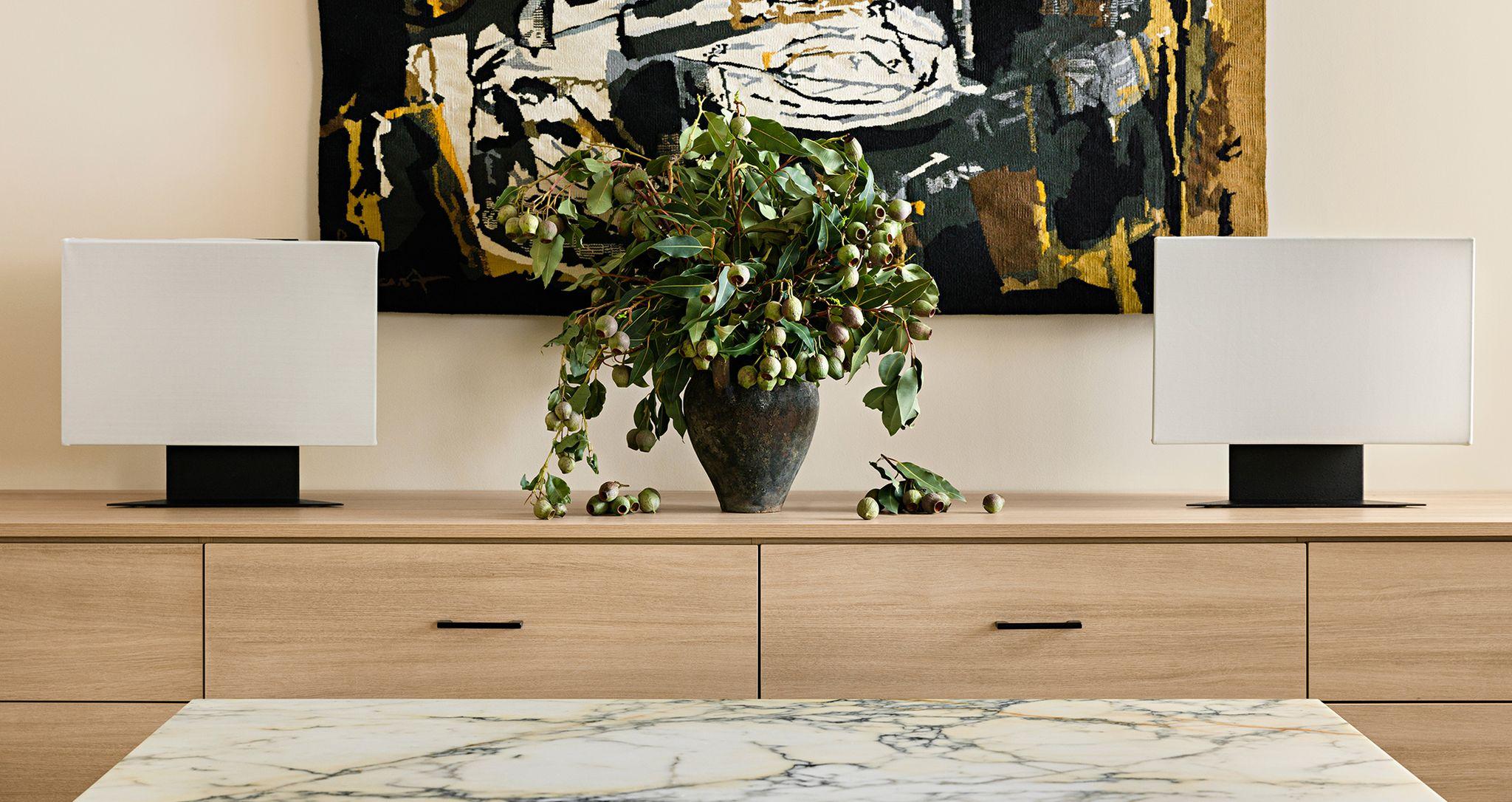 Custom office drawers in a light wood grain finish by California Closets