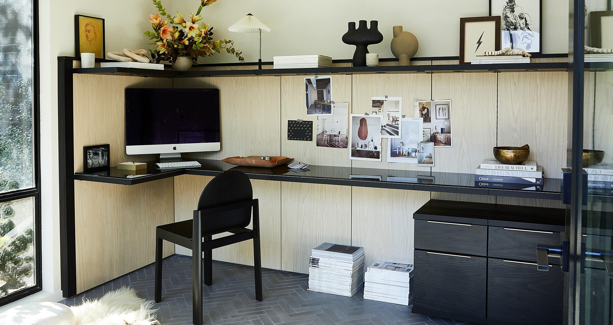 Home office design with L-shaped work desk and shelving created by California Closets