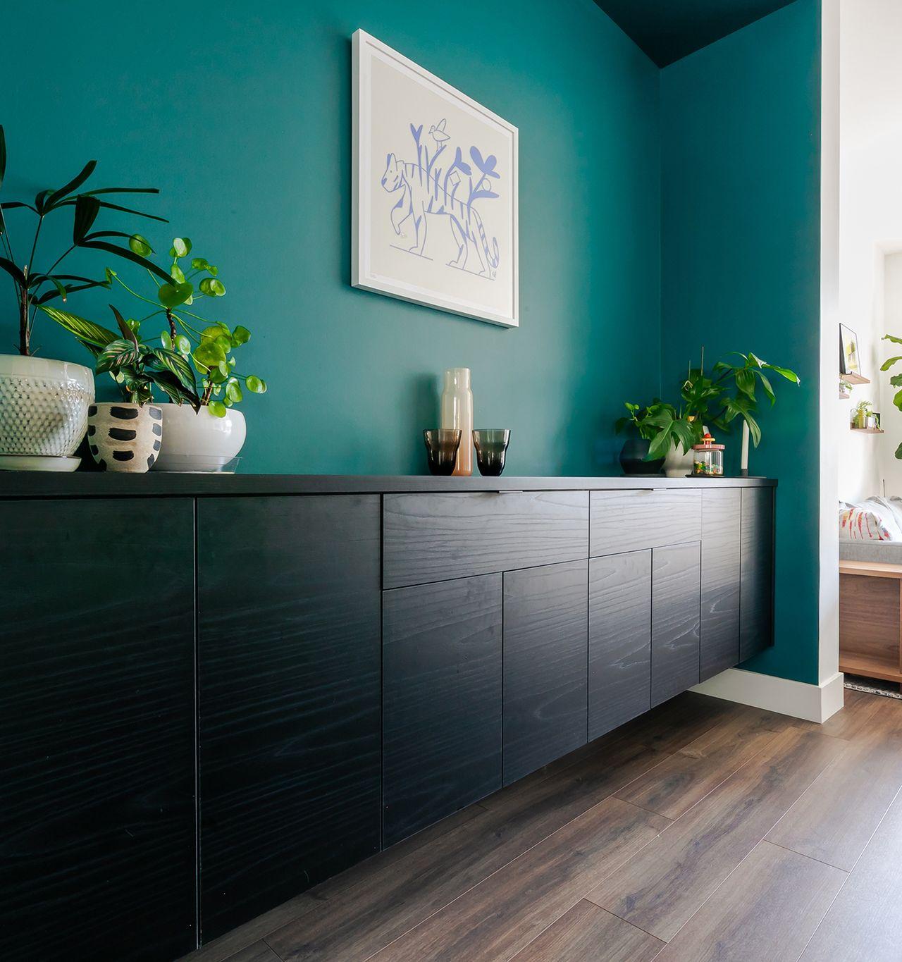Floating media storage cabinets in dark wood finish by California Closets