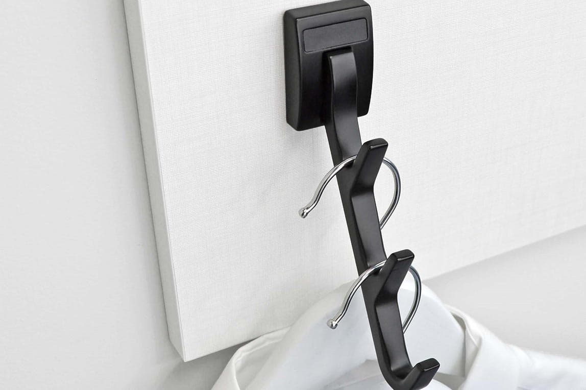 Custom laundry accessories with hooks for to hang-dry or steam clothes design by California Closets