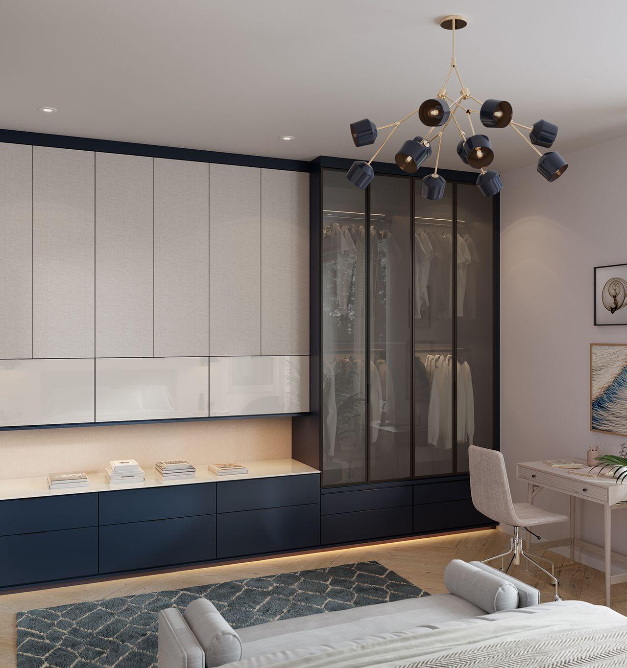 Wardrobe closet with additional storage designed in a navy blue matte finish, glass closet doors and pull out drawers by California Closets