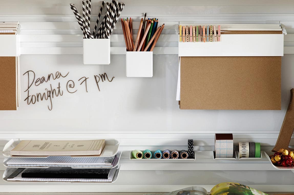 Personalized home office storage for supplies with aluminum hooks and bins by California Closets