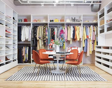 Commercial showroom custom designed with wardrobe storage shelving and cabinets by California Closets